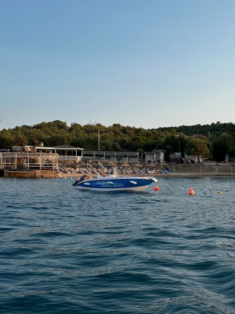 Blue boat at golden hour by the Sea Breeze bar